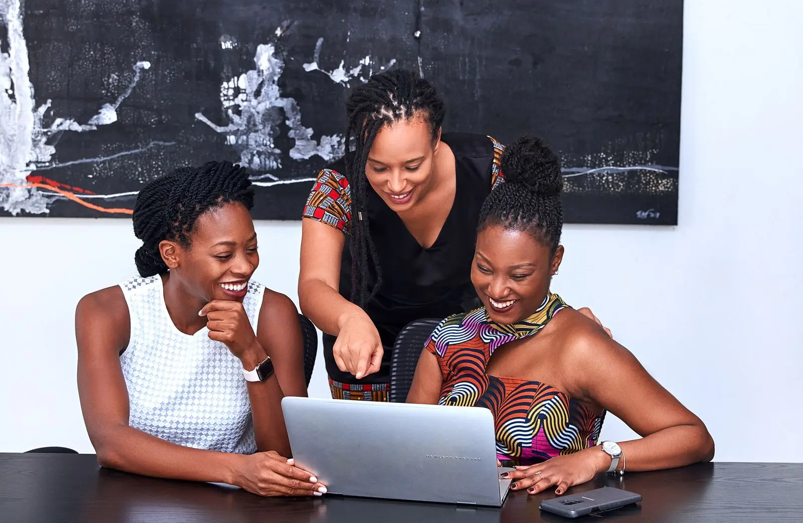 African women collaborating around a laptop