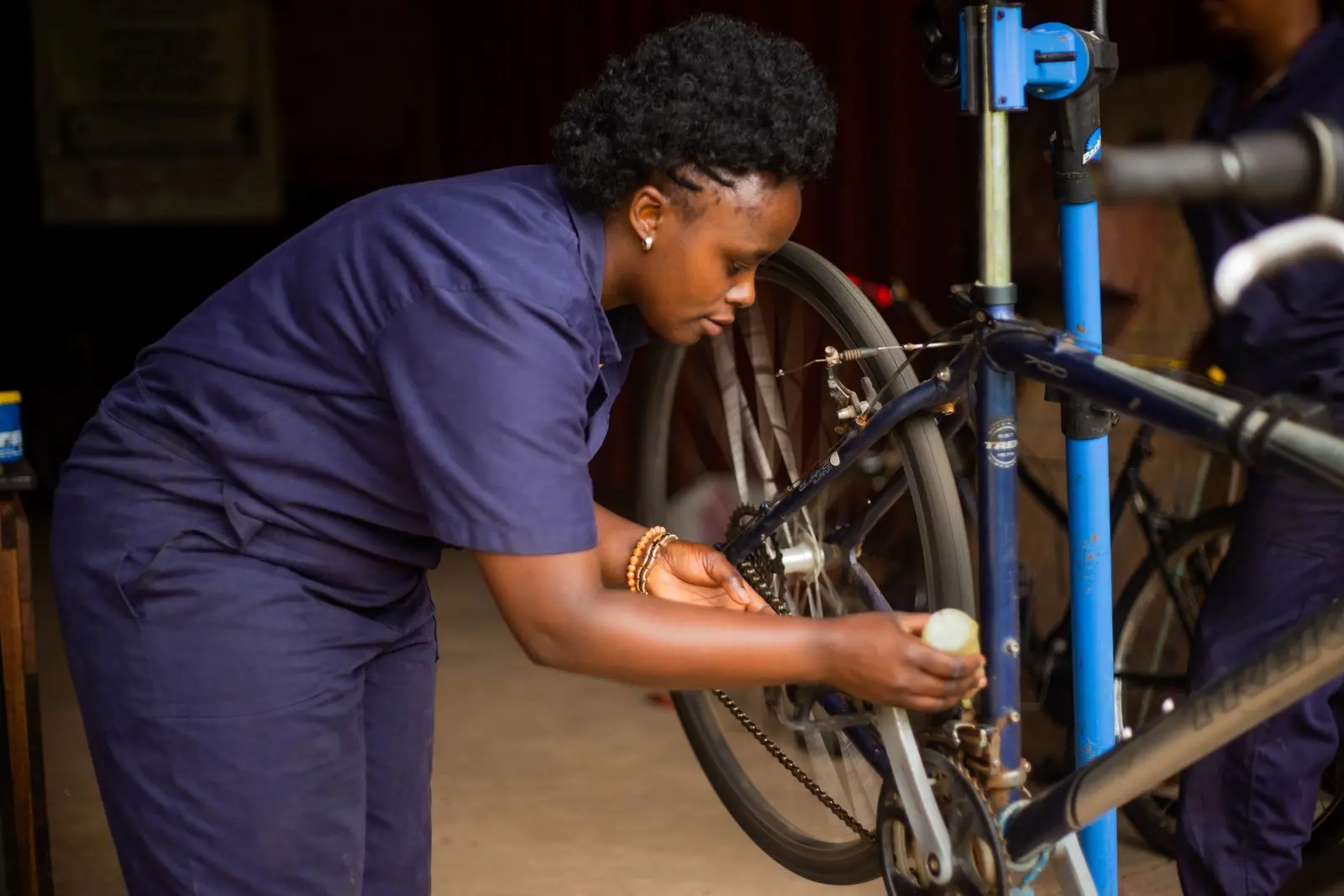 African women developing practical repair skills in a workshop